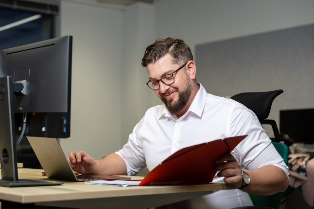 A photo of someone reading the Spyrosoft AdTech Book
