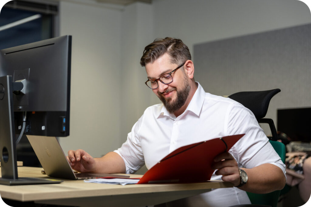 An image of a Spyrosoft AdTech employee reading.
